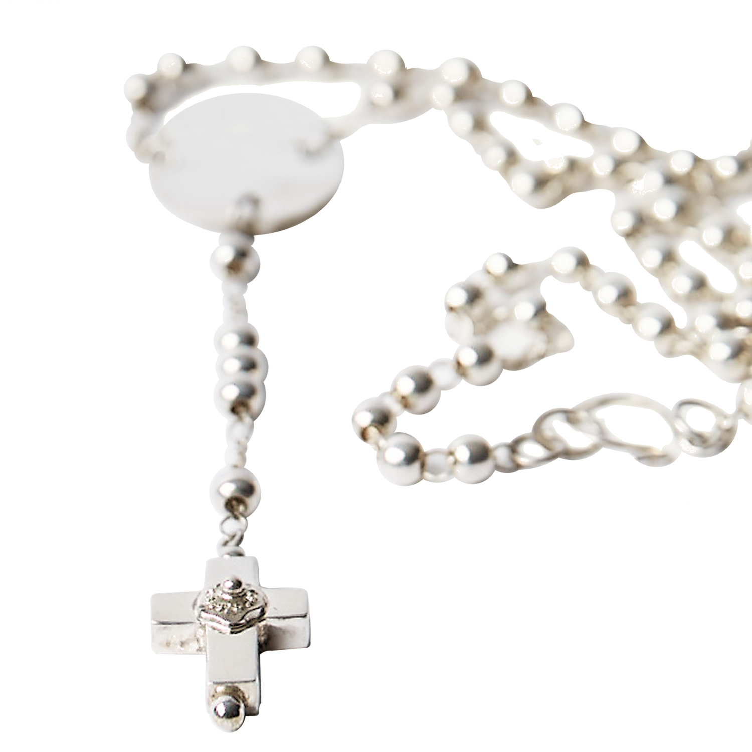 A delicate silver necklace with a fine chain design and a circle near the end with a cross charm in the end, displayed on a plain background.
