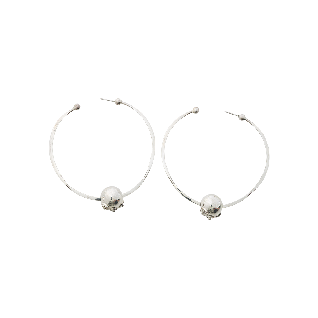 Two simple  earring hoops with a silver bead. Plain background.