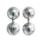 Two earrings with two silver spheres and a small one between each sphere. One earring has three signature seals engraved.