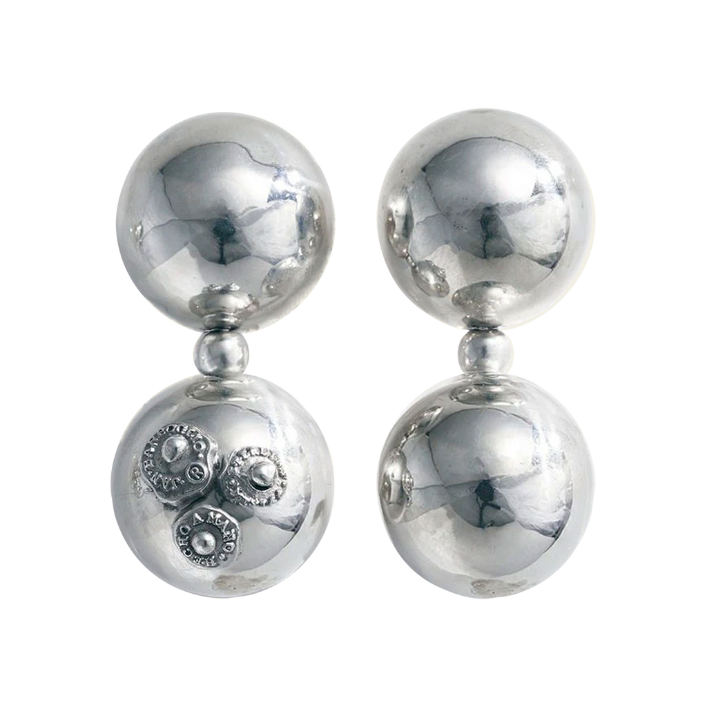 Two earrings with two silver spheres and a small one between each sphere. One earring has three signature seals engraved.