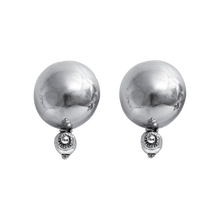 Two silver circle earrings with a silver ball underneath.