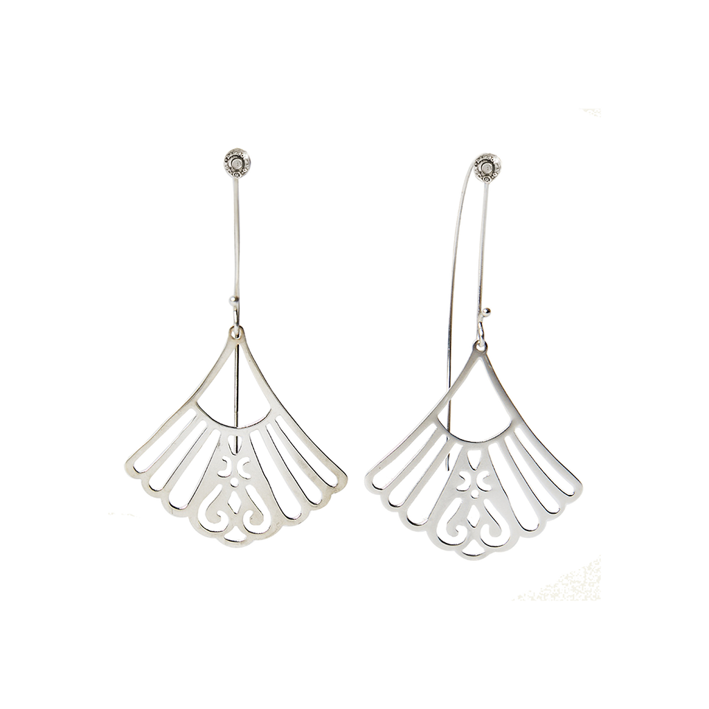 Two silver earrings in a fan shape hold by a hook with thee designer's seal.