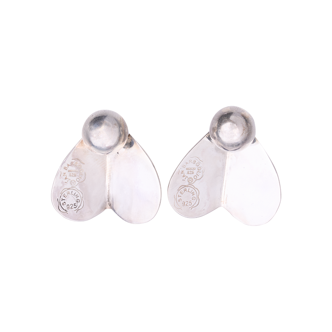 Two silver earrings with engraved seals. 