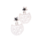 Two silver earrings with a flower at the top. The flower has a volcanic black stone in the center. Below the flower is an open  fan shaped piece with an intricate design.