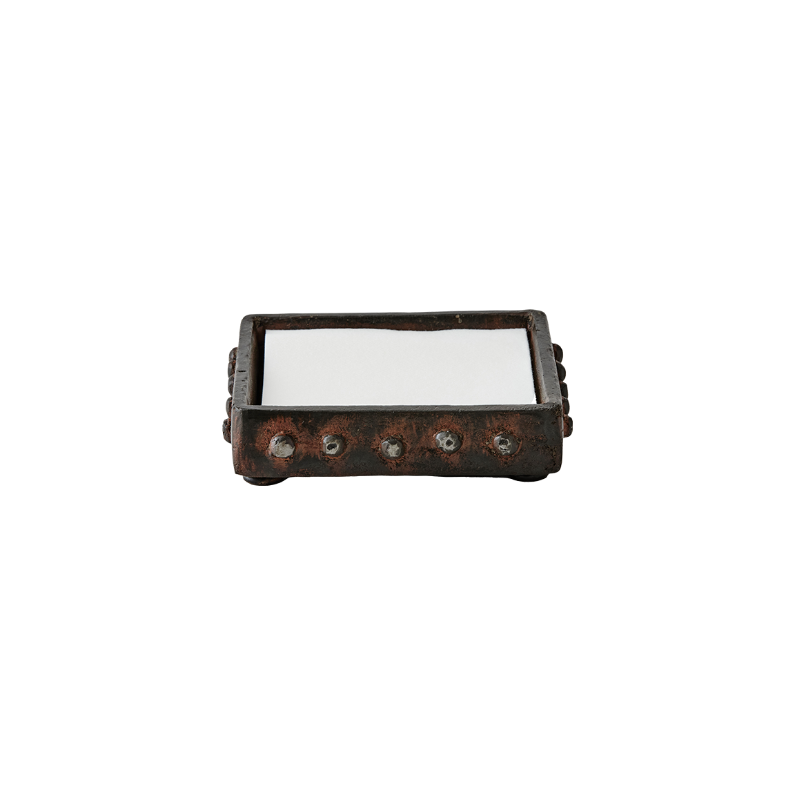 Wax cast iron square napkin holder with beaded detail trim. White napkins in the center.