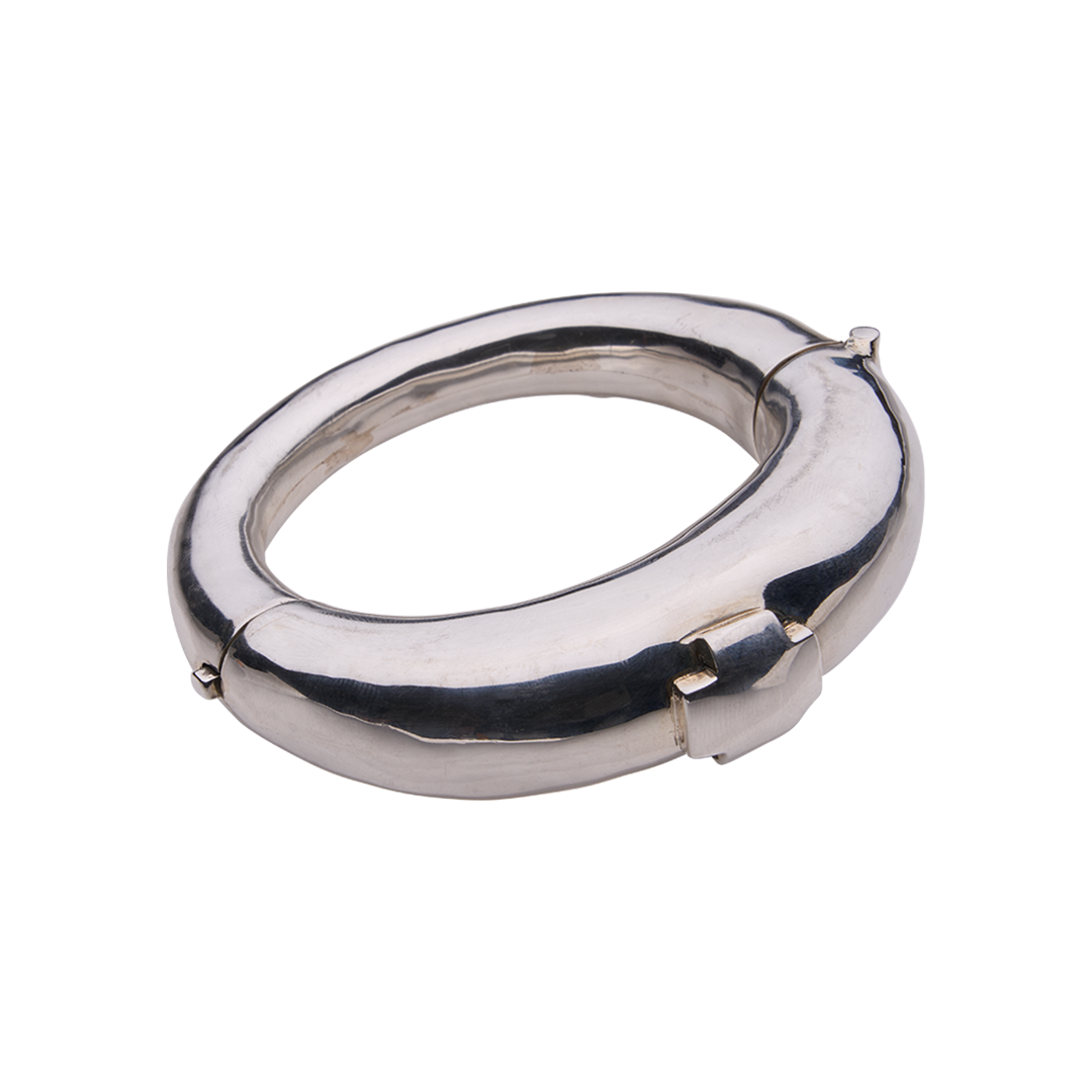A silver bracelet featuring a cross. 