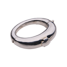 A silver bracelet featuring a cross. 