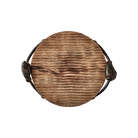 A rough-hewn round cutting board with cast iron bird handles from top view.