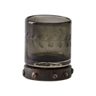 A mouth blown and engraved smoke colored shot glass with beaded iron base.