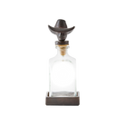 A cowboy iron decanter topper with vintage style glass bottle and iron coaster. 