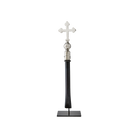 A nickel plated cross with natural iron handle supported on a gallery stand.