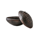 A iron football box with the lid resting on its side.