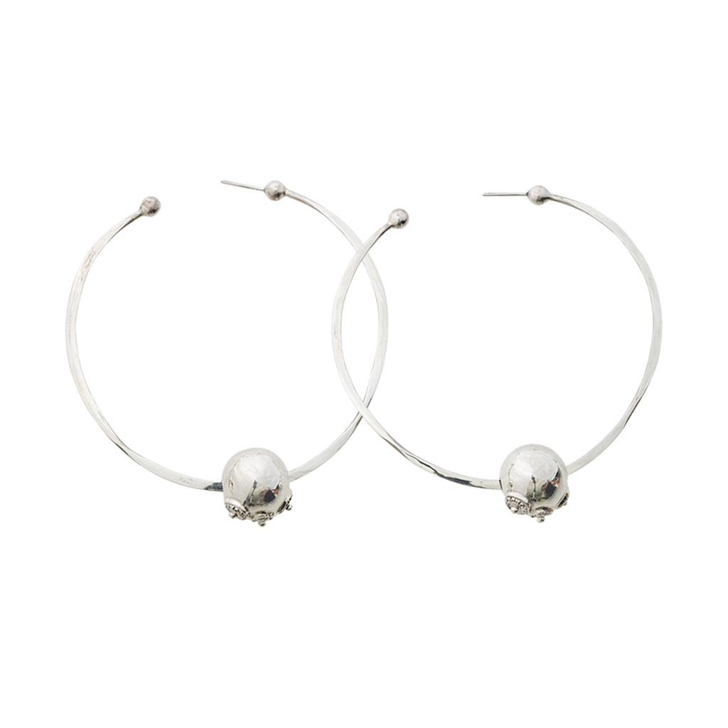 Two simple  earring hoops with a silver bead. Plain background.