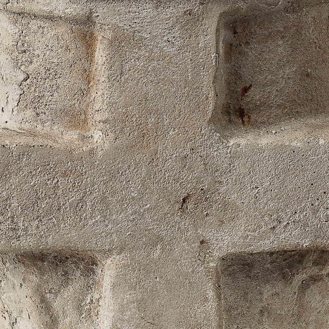 A close up to a stone with a cross.