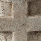 A close up to a stone with a cross.