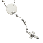 A delicate silver necklace  with a fine chain design and a circle near the end with a cross charm in the end, displayed on a plain background.