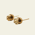 Two pair of bronze and  golden studs