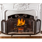 A hand forged fire screen with heavy iron frame. In front of a lit white chimney.